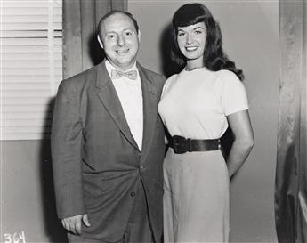 (BETTIE PAGE - PIN UP) Group of four Bettie Page snapshots with Irving Klaw and Roz Greenwood.